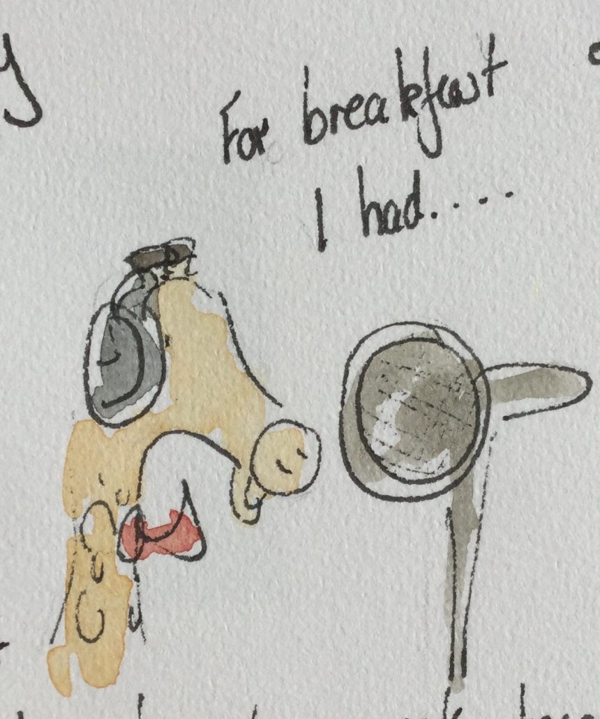 M G with headphones in front of a mic